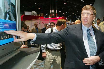 Bill Gates demonstrating Microsoft TV Foundation Edition at the NCTA 2003 show. Photo copyright Microsoft.
