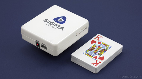 Sigma Designs 8670-2110 Ultra Thin reference design set-top box on a mains plug.