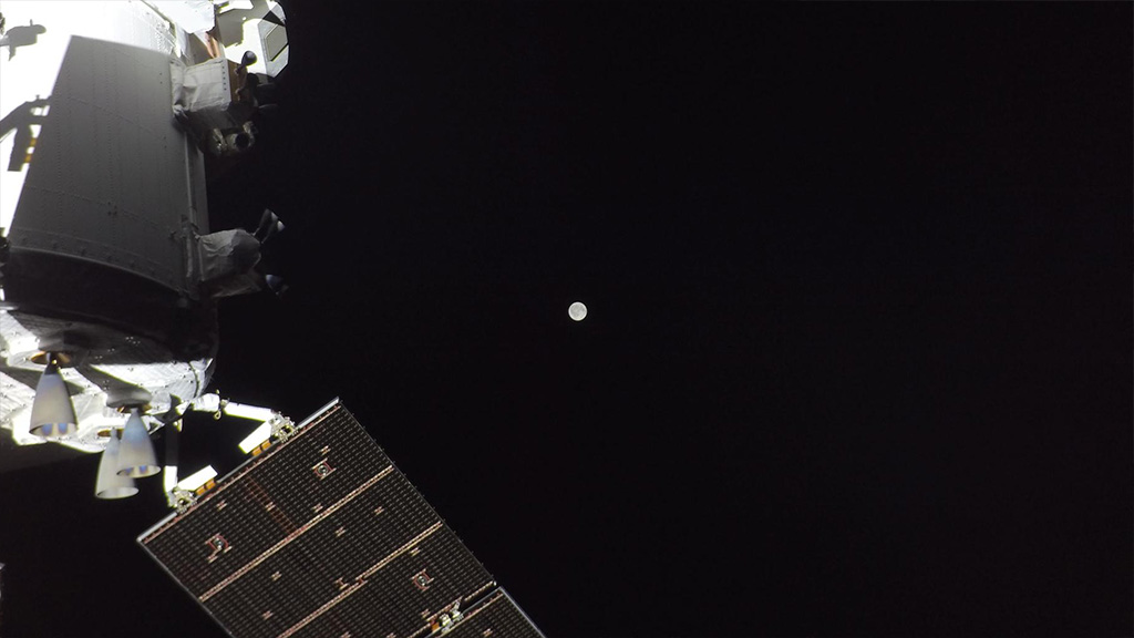 Hello-Moon. April 3, 2026. The Artemis II crew is en route to the Moon on the second flight day of the mission. This photo shows the Orion spacecraft with the Moon in the distance, as captured by a camera on the tip of one of its solar array wings. Source: NASA